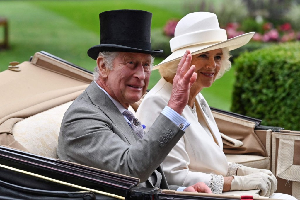 Britain's King Charles III (L) and Britain's Queen Camilla arrive to attend the races on the first day of the Royal Ascot horse racing meeting, in Ascot, west of London, on June 20, 203. (Photo by JUSTIN TALLIS / AFP) (Photo by JUSTIN TALLIS/AFP via Getty Images)