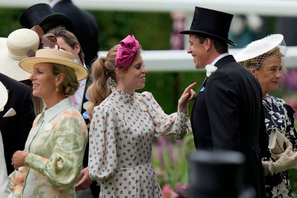 Princess Beatrice, centre, gestures as she arrives for day one of the Royal Ascot horse racing meeting, at Ascot Racecourse in Ascot, England, Tuesday, June 20, 2023.(AP Photo/Alastair Grant)